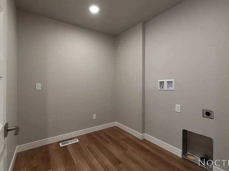 Huge laundry room with extra storage that is upstairs with all of the bedrooms. Washer and dryer will be provided. (Photo of another unit with similar finishes and quality.)