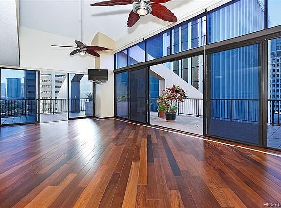 Beautiful Ipe floors with curly maple boarder.  Looking outside to 800 square foot wrap around lanai.