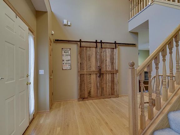 Grand two story entry is 13x11! Newer stylish doors to the den.