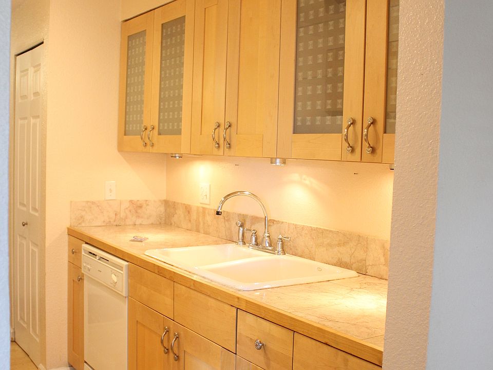 Kitchen with glass door cabinets, under counter lighting