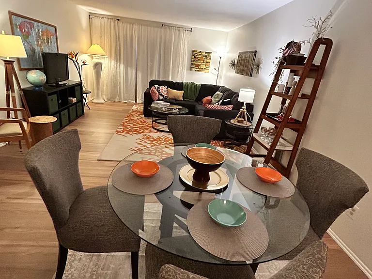 Dining Room & Living room leading to a large balcony.