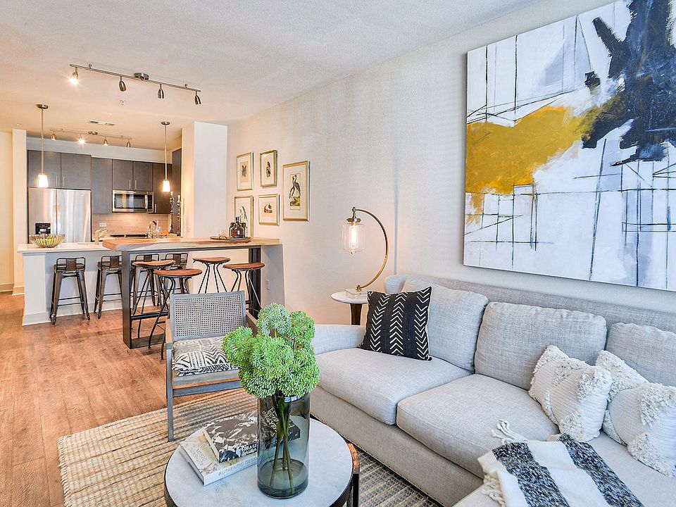 Continuous wood-style flooring throughout the living areas