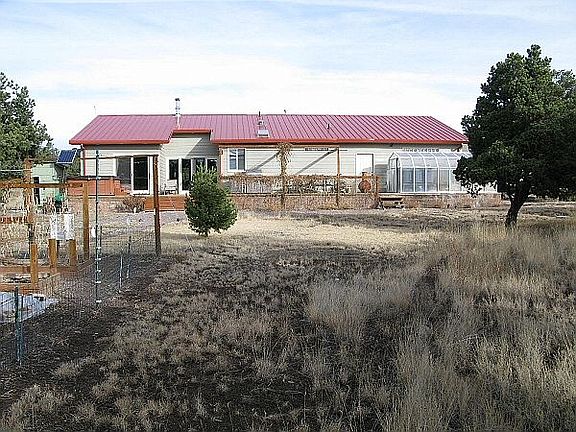 Back of home with garden