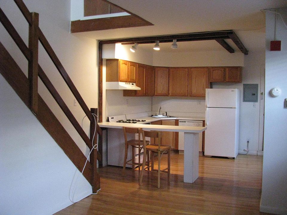 Kitchen w/ breakfast bar (looking from living room)