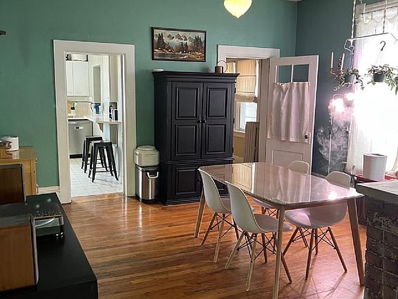 Very large, very light dining room graced with a wood burning fireplace.