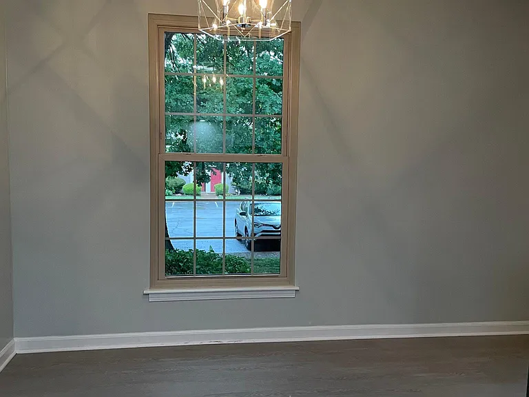 Dining area with contemporary chandelier.