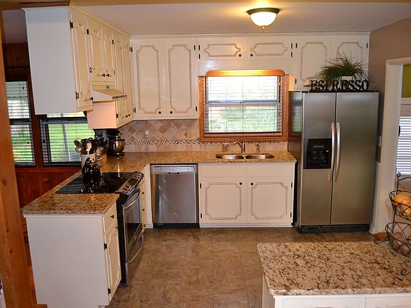 A cooks dream! A kitchen with granite countertops and stainless appliances