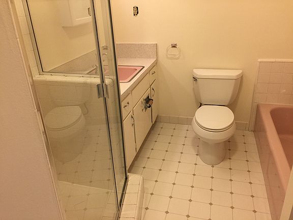 Bathroom with separate stall shower and tub