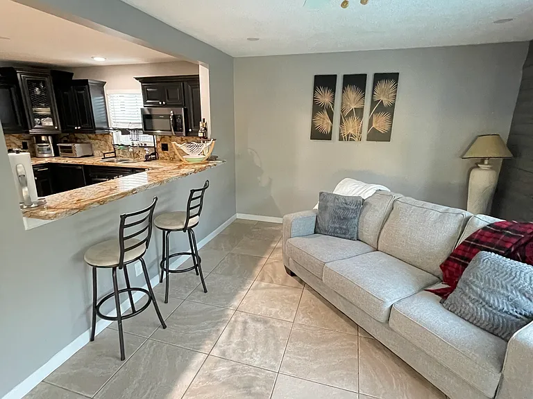 Additional living room with view to kitchen.