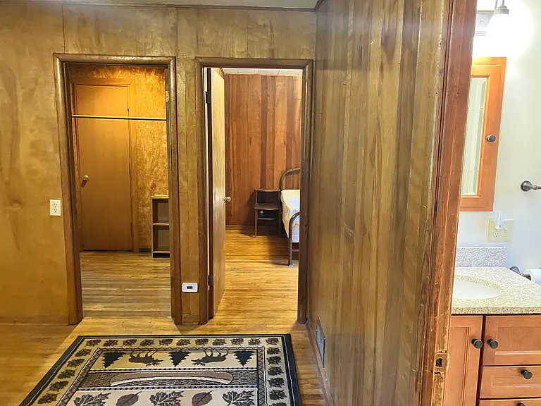 Telephone room looking towards the bedroom (to the right) and a small hallway/closet leading to the fireplace room