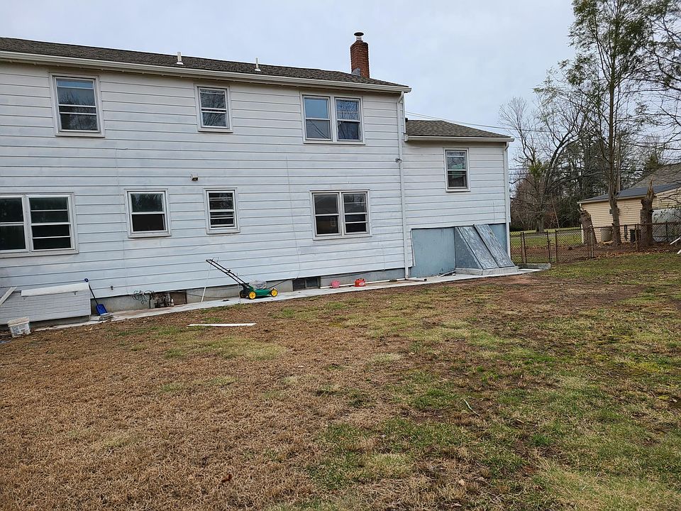 The back of the house line with concrete perfect place to place a grill during summer. Also the one can place a grill next a to the kitchen widow and easily get food inside the kitchen to outside