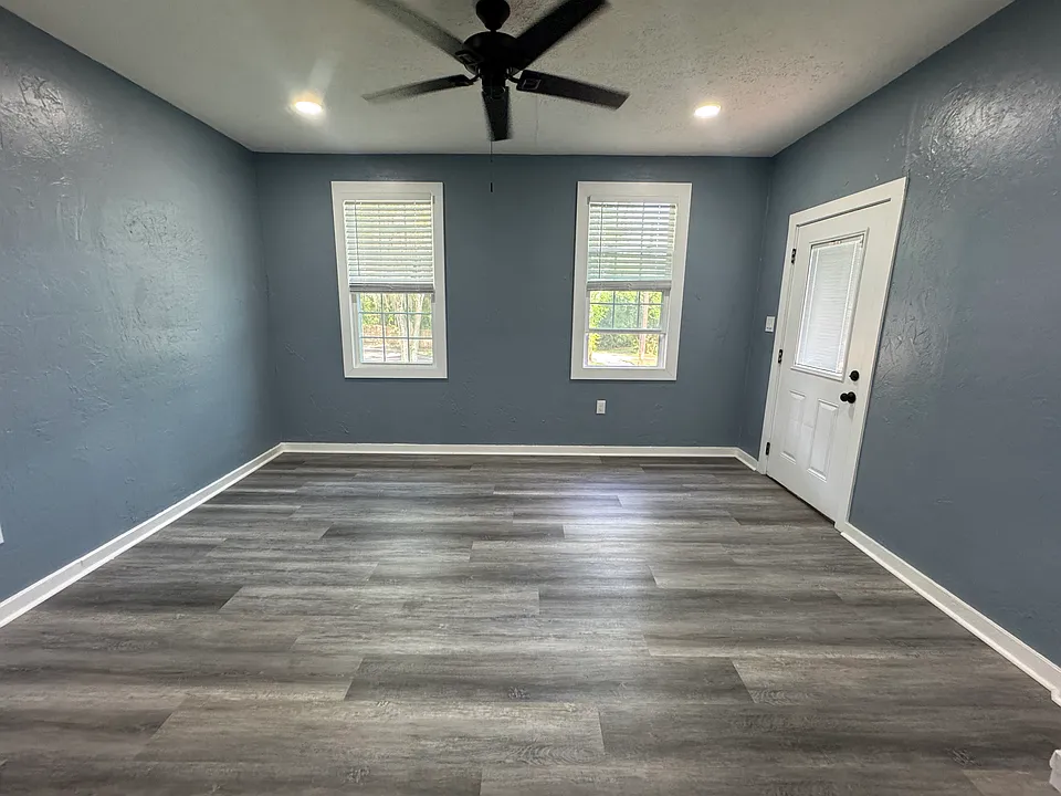 FAMILY ROOM VIEW WITH FRONT DOOR ENTRANCE