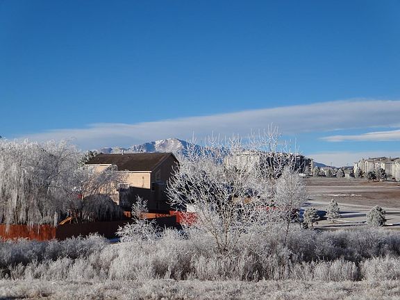 Open space behind and Pikes Peak in the winter