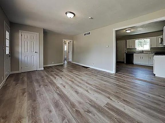 Living room has a coat closet and mountain view.