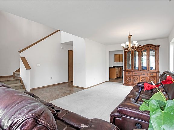 Walk into this open hallway to formal living & dining area combo>