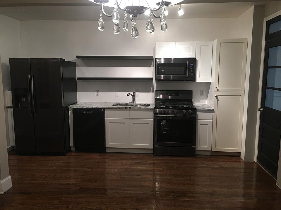 Gorgeous, galley kitchen with new, black stainless steel app