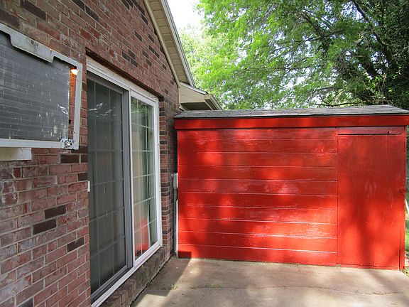 Back patio and storage shed 220 has half of.