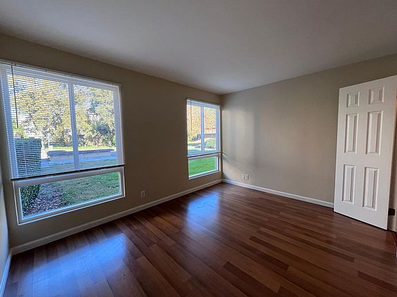 bedroom with large windows new blinds