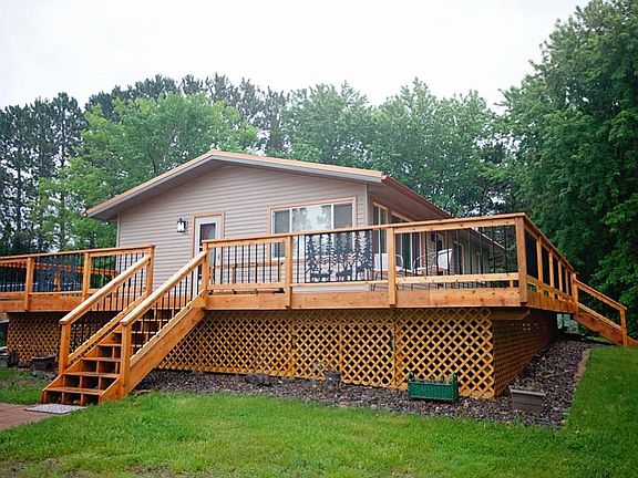 GORGEOUS new cedar decking surrounds the home, making the perfect space for entertaining.