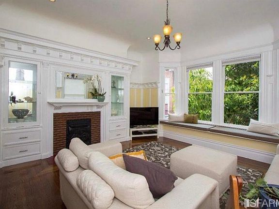 Living room with staging furniture. Currently unfurnished
