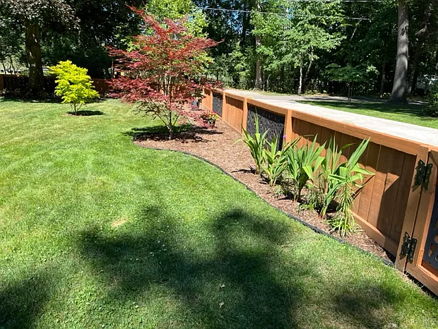 enclosed front yard with perennial beds