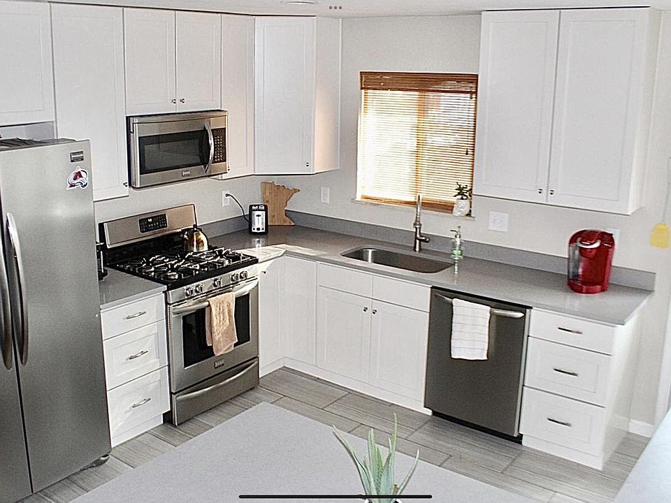 Bright kitchen with Updated Stainless Appliances and Quartz Countertops.