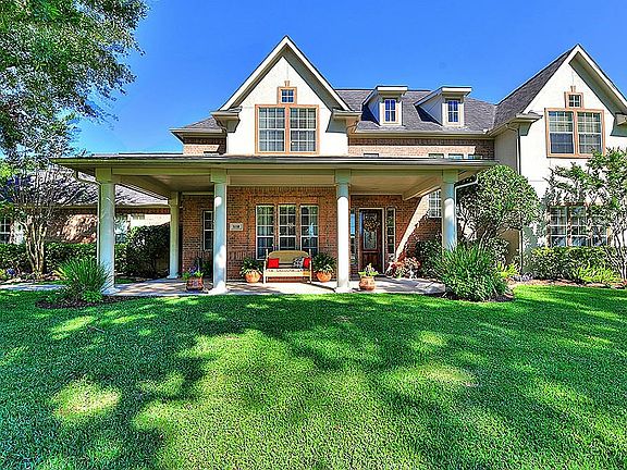 The three car garage is accessed from the rear, so no garage doors in front to disrupt the lines of the home.