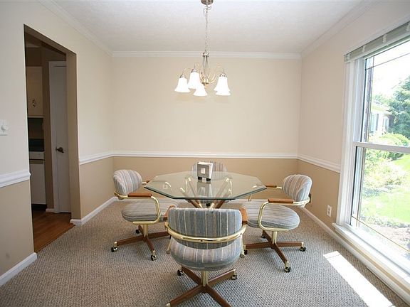 Formal dining room receiving tons of natural light.