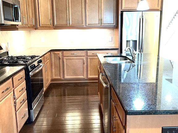 Fantastic kitchen with SS appliances, granite countertops, tile backsplash and large size island.