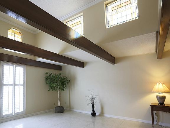 This is the other end of the living space. High beams and upper windows create great architectural i