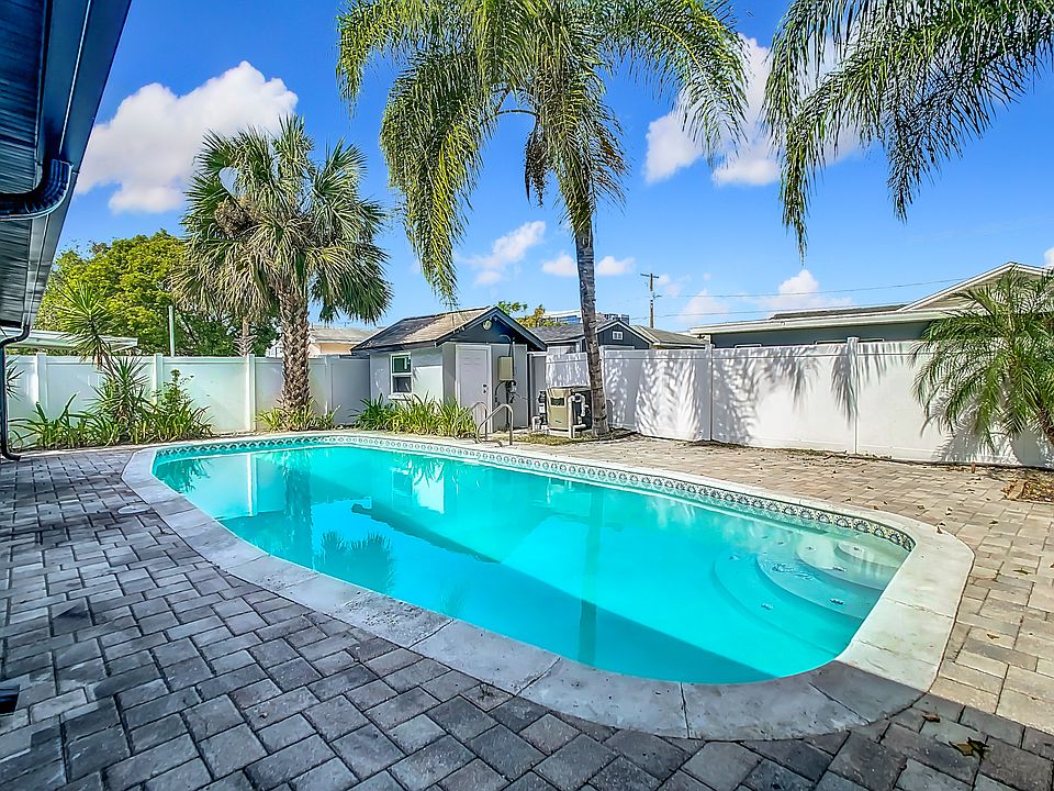Huge pool that has a heater. Has a storage room for bikes, pool toys and garden tools