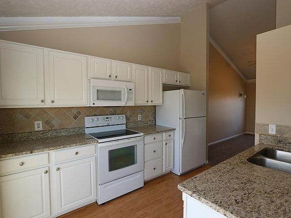 Granite counters! Stainless sink, cathedral ceilings. Appliances included.