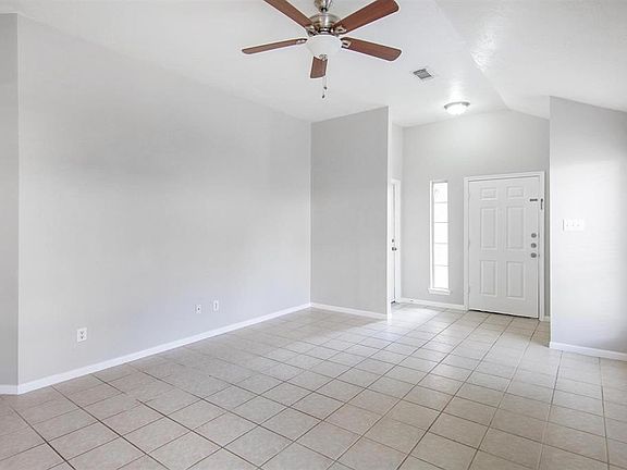Entrance and door to 2 car attached garage. Coat closet to the right of front door.