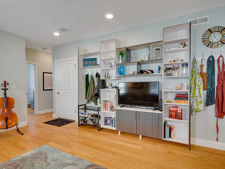 Built-in cabinetry and shelving designed to complement the kitchen cabinetry