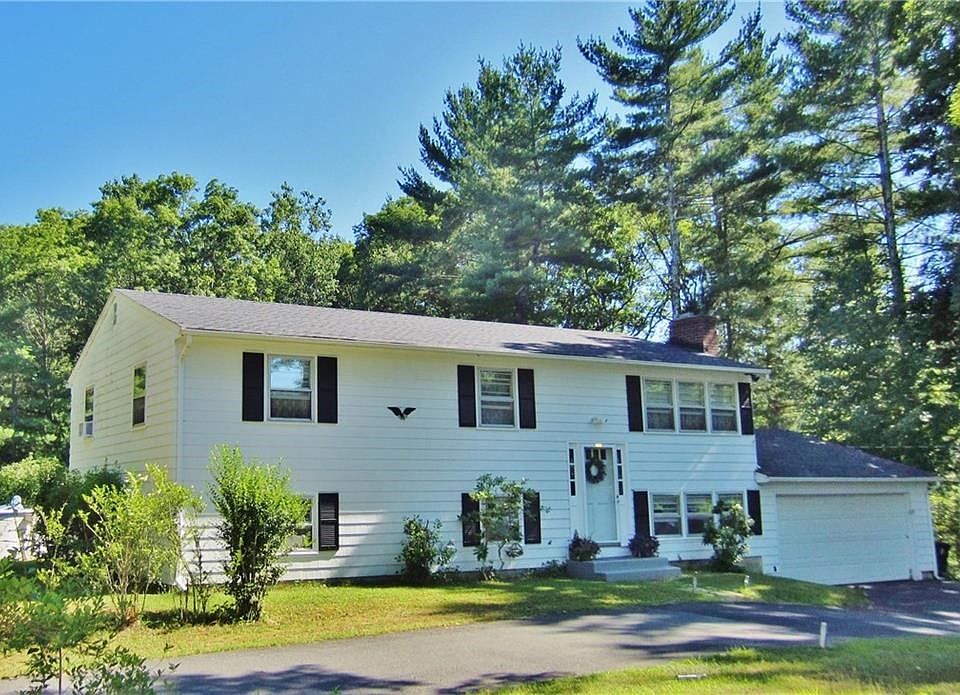 Welcome to this Wonderful Raised Ranch Nestled on Over  of an Acre of Land! You have Johnsons Pond Access by a Brook thats on yo