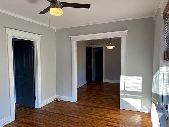 Sunny Living Room looking into Open Dining room.