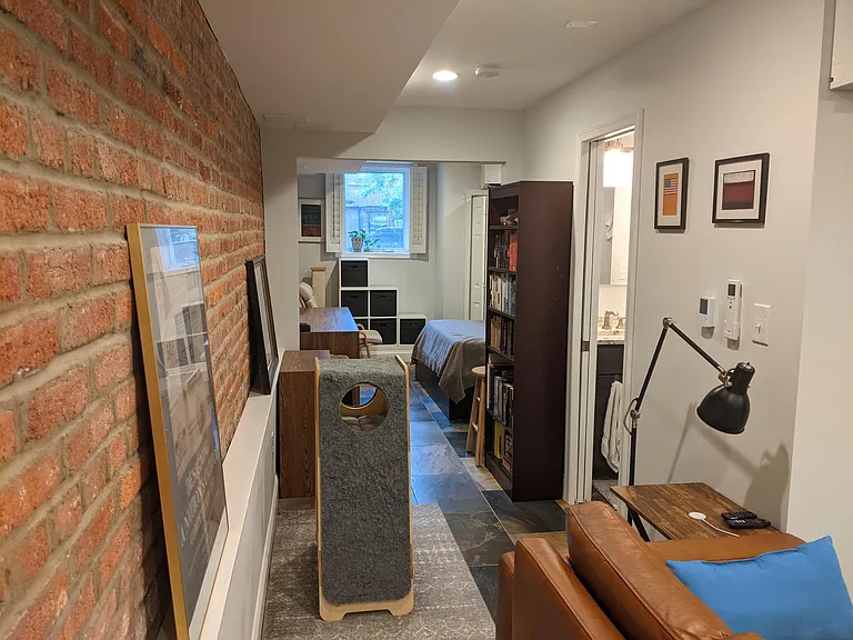 "hallway" area is wide enough to fit bookshelves and/or a desk