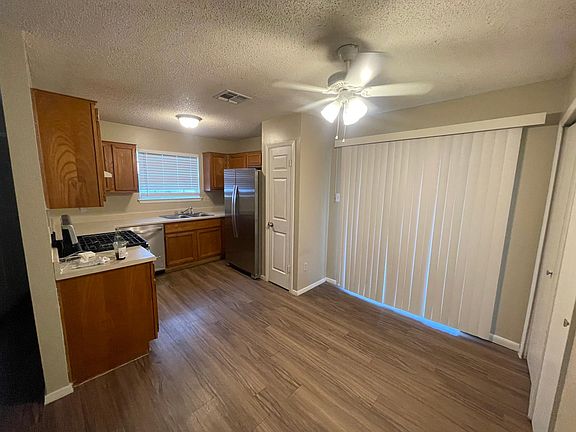 Open dining and kitchen. Note new stainless appliances