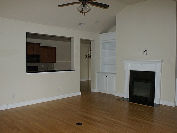 Vaulted Great Room with Built-In Bookcases and Fireplace