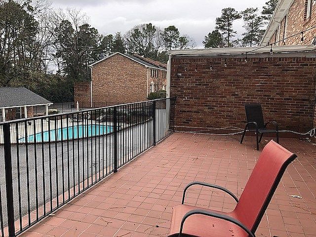 deck overseeing the pool
