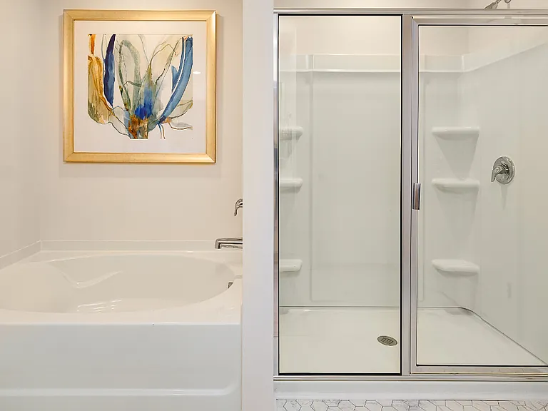 Primary Bath. Photos are builder provided and do not reflect current furnishings or finishes.