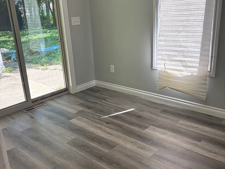 Bedroom with sliding glass door to backyard
