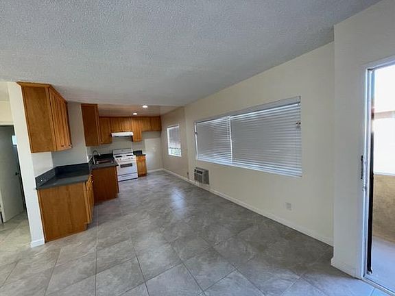 Another view of living/dining/kitchen areas