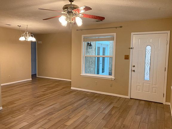 living and dining area with view of the hall to the bedrooms