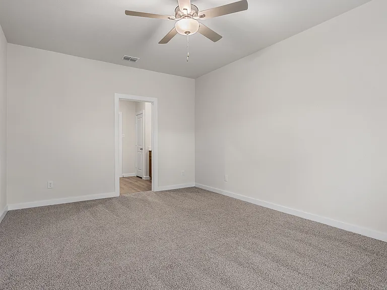 The master suite has a large bedroom, ensuite bathroom and a walk-in closet.