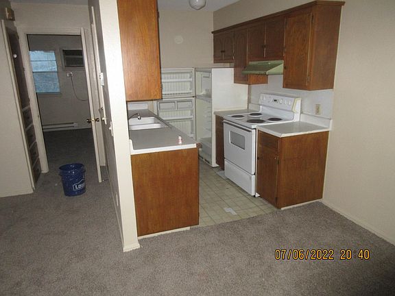Entry to Bedroom and view of Kitchen