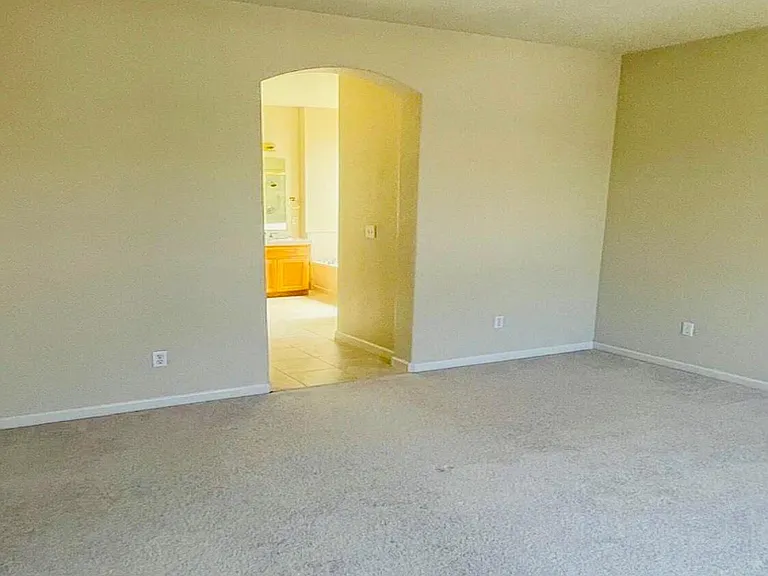 View of master bedroom to bathroom.