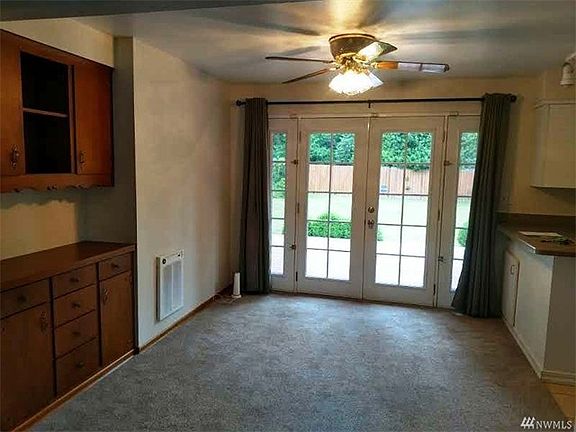The dining room is off the kitchen and has access thru French doors to the huge backyard and deck, a perfect spot to entertain!