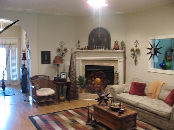 Den with fireplace into foyer