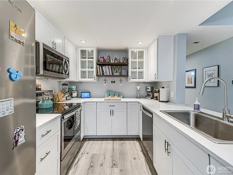 Oodles of cabinetry, storage, and every pot and pan, and cookbook have a home.